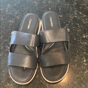 Calvin Klein black platform slip ons